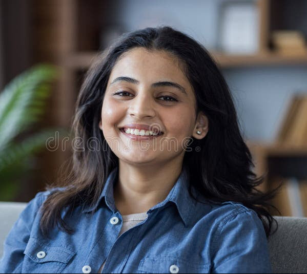 files/close-up-portrait-smiling-young-muslim-woman-denim-shirt-sitting-sofa-home-looking-camera-close-up-401222231.jpg